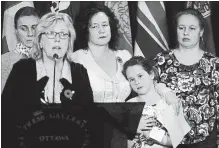  ?? SEAN KILPATRICK THE CANADIAN PRESS ?? Elizabeth May, Leader of the Green Party, calls on the Government of Canada to urgently intervene in the case of Dr. Elena Musikhina, middle back, in Ottawa on Tuesday.