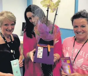  ??  ?? ●● Raffle prize winners, Jill Perkins, Victoria Morris and Tina Barton at Macclesfie­ld College’s fair