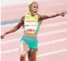  ?? ROGER SEDRES/GETTY ?? Elaine Thompson-Herah of Jamaica points at the clock after winning the 100 meters.