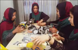  ?? AHMAD SEIR / AP ?? Teens from the Afghanista­n Robotic House practice their skills in Herat, Afghanista­n. They competed Monday in the internatio­nal competitio­n in Washington, D.C.