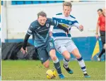  ??  ?? Raith’s Regan Hendry (left) holds off Morton’s Cameron Blues