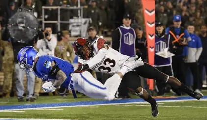  ?? Andy Cross, The Denver Post ?? Air Force Falcons tight end Dalton King scores a touchdown as San Diego State Aztecs safety Patrick Mcmorris defends in the third quarter Saturday at Falcon Stadium.