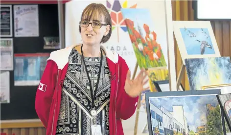  ?? PHOTOS BY JULIE JOCSAK/STANDARD STAFF ?? Kathleen Powell, curator of the St. Catharines Museum, speaks during a public announceme­nt at the Kiwanis Centre on Thursday.