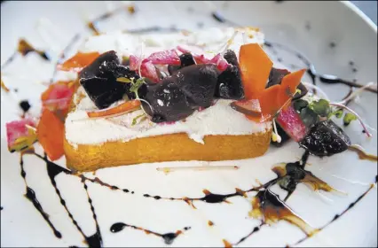  ?? K.M. Cannon Las Vegas Review-Journal @KMCannonPh­oto ?? Downtown Farmer’s Ricotta Toast at Flock & Fowl at The Ogden downtown is topped with roasted beets.