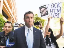  ?? Denis Poroy / Associated Press ?? Rep. Duncan Hunter, RAlpine (San Diego County), leaves federal court after a hearing. He faces a trial on felony charges.