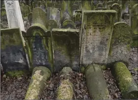  ?? PHOTO/ ?? This photo shows gravestone­s at the Jewish Cemetery on Okopowa Street in Warsaw, Poland on Friday. The Polish government is donating 28 million to preserve the cemetery. AP CZAREK SOKOLOWSKI