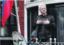  ?? Luke MacGregor / Bloomberg ?? Julian Assange speaks to his supporters from the balcony of Ecuador’s embassy in London yesterday.