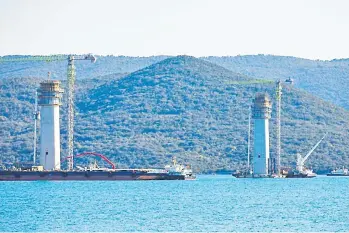  ??  ?? The Peljesac Bridge near Komarna is under constructi­on, in Croatia, April 17, 2020. [Milan Sabic/Pixsell/Handout via Xinhua]