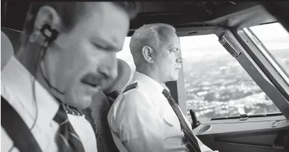  ?? THE ASSOCIATED PRESS ?? Tom Hanks, right, and Aaron Eckhart in a scene from “Sully.”