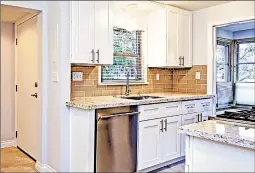  ?? DREAMSTIME ?? For the first time, quartz countertop­s have surpassed stone, according to the 2019 Houzz Kitchen Trends Study. Also, white remains locked in as the top cabinetry color.