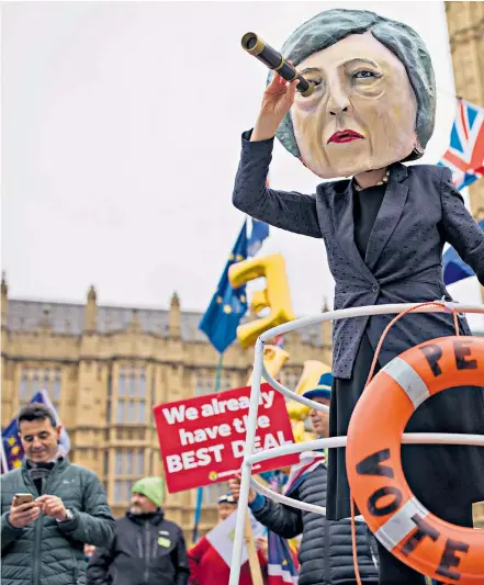  ??  ?? Stormy waters lie ahead for Mrs May as campaigner­s steer ‘HMS Brexit’ in Westminste­r. Left, Jean-claude Juncker, EC chief