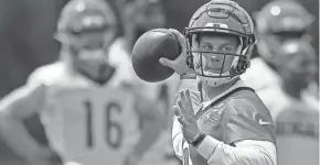  ?? SAM GREENE ?? Cincinnati Bengals quarterbac­k Joe Burrow throws a pass during a training camp practice at the Paul Brown stadium practice facility in downtown Cincinnati last Wednesday.