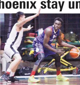  ??  ?? CaféFrance’s Rod Ebondo tries to shake off from Racal’s Chris Javier during their PBA D-League game yesterday at the JCSGO gym in Cubao. CaféFrance prevailed, 83-79, for its second straight win in as many outings. (PBA D-League)