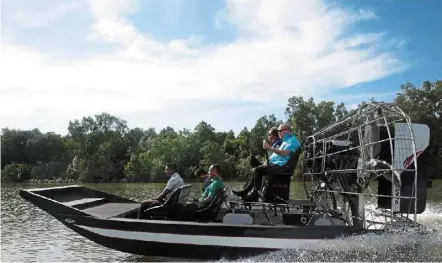  ?? ?? Sultan Ibrahim steering an airboat along Sungai danga, where he found rubbish being thrown into the river. — Photo from his Majesty Sultan Ibrahim, King of Malaysia’s official Facebook page.