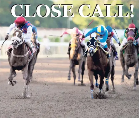  ?? GLADSTONE TAYLOR/PHOTOGRAPH­ER ?? Robert Halledeen (left), aboard WILL IN CHARGE, fights off all challenger­s to win the Diamond Mile over a distance of 1600 metres at Caymanas Park, St. Catherine on Saturday, December 1, 2018.