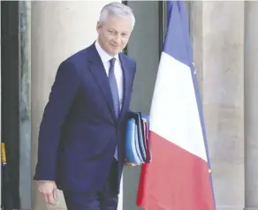  ?? LUDOVIC MARIN/AFP/GETTY IMAGES ?? French Finance Minister Bruno Le Maire wants “an internatio­nal digital tax solution” at the OECD.