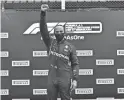  ??  ?? Mercedes driver Lewis Hamilton of Britain celebrates on the podium after winning the Styrian Grand Prix in Spielberg, Austria, on Sunday.
