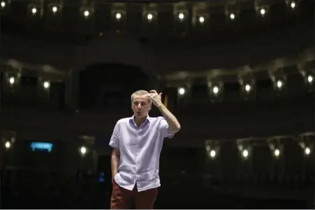  ?? ALEXANDER ZEMLIANICH­ENKO — THE ASSOCIATED PRESS ?? Makhar Vaziev, ballet director of the Bolshoi Theater, gestures as he conducts a rehearsal in the Bolshoi Theater in Moscow last month.