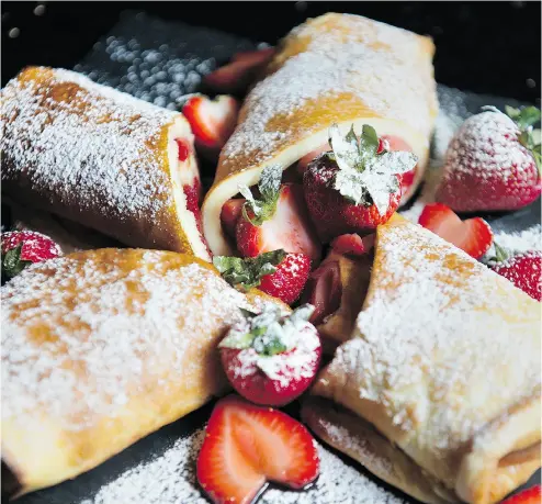  ?? PETER J. THOMPSON / NATIONAL POST ?? Bonnie Stern’s Puff Pancake with Strawberri­es. When it comes to eating in (or eating out) for Mother’s Day, brunch seems to be the most popular meal, Stern writes.