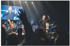  ?? (The New York Times/Andrew White) ?? Carl Lentz, a pastor who once ministered to pop stars and profession­al athletes, speaks onstage at Hillsong NYC, at the Manhattan Center’s Hammerstei­n Ballroom in 2017. Lentz is among the ministers featured on the PreachersN­Sneakers Instagram account, which showcases pastors’ high fashion choices alongside their high dollar amounts.