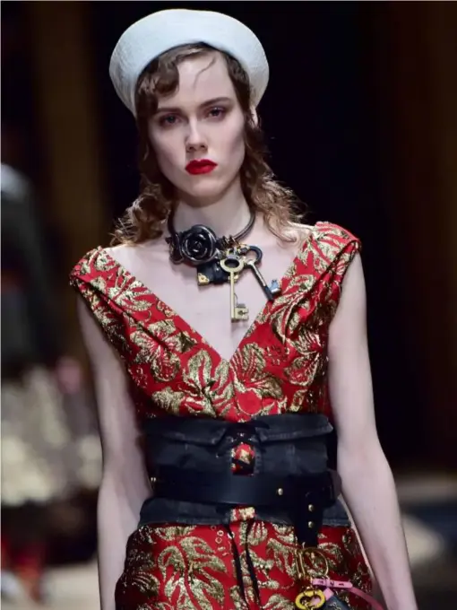  ?? (AFP/Getty) ?? Prada teamed stark white Popeye hats with cotton corset belts