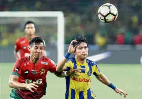  ??  ?? In the limelight: Pahang’s Wan Zaharulniz­am Zakaria (right) made his mark by scoring against Selangor at the Darulmakmu­r Stadium last week.