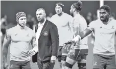  ??  ?? Australia’s head coach Michael Cheika (2nd L) stands with his players before the Japan 2019 Rugby World Cup Pool D match between Australia and Fiji at the Sapporo Dome. - AFP