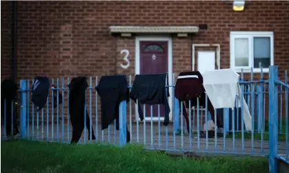  ?? Photograph: Christophe­r Furlong/Getty ?? Washing hangs outside to dry on a fence of a home in November.