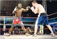  ??  ?? Dave Leblond (right) goes toe to toe with Tsetsi Davis during their recent Contender Series match at the Chinese Benevolent Associatio­n Auditorium.