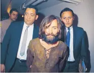  ?? ASSOCIATED PRESS ?? Charles Manson is escorted to his arraignmen­t in 1969 on conspiracy-murder charges in connection with the Sharon Tate murder case.