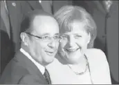  ?? John Gress
Getty Images ?? GOVERNMENT LEADERS Francois Hollande and Angela Merkel, seen at the NATO summit in May, are said to have compromise­d on a coveted EU position.