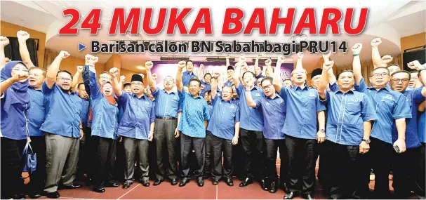  ?? GambarBern­ama ?? MUSA mengangkat tangan bersama calon-calon Barisan Nasional (BN) selepas membuat pengumuman calon BN pada Majlis Pengumuman Calon BN Negeri Sabah Pilihan Raya Umum Ke-14 di Bangunan UMNO pada Khamis.