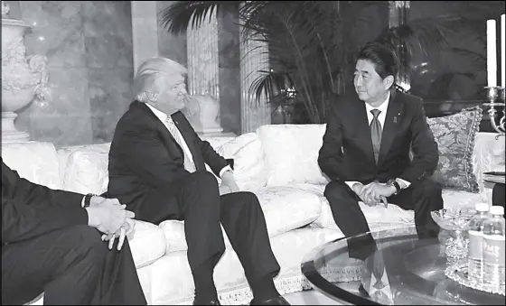  ?? Japan’s Prime Minister Shinzo Abe (right) meets with US president-elect Donald Trump at Trump Tower in Manhattan, New York. REUTERS ??