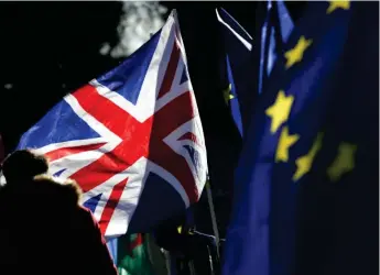  ??  ?? British and EU flags