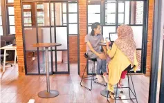  ??  ?? Photo shows entreprene­urs working at the EV-Hive event space, a co-working space, in Jakarta. Indonesia has seen a surge of cash into its technology sector over the past two years, helping support dozens of homegrown start-ups ranging from ride hailing...