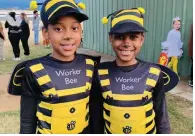  ?? (Special to The Commercial) ?? Two girls showed up as worker bees during the 2022 Halloween event at Taylor Field.