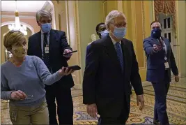  ?? SUSAN WALSH — THE ASSOCIATED PRESS ?? Senate Majority Leader Mitch McConnell walks past reporters on Capitol Hill in Washington on Tuesday.