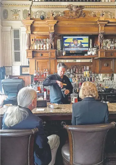  ?? Ceil Miller-bouchet, for The Washington Post ?? Guests wait for drinks at the lobby bar of the Brown Hotel.