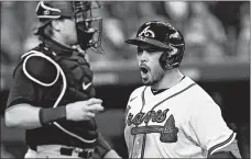  ?? ERIC GAY/AP ?? Travis d’Arnaud celebrates after hitting a three-run homer in the Braves’ win.