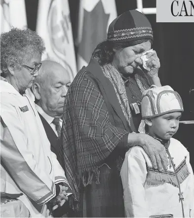  ?? ANDREW VAUGHAN / THE CANADIAN PRESS ?? Elders offer prayers before Prime Minister Justin Trudeau delivered an apology in Goose Bay, N.L., on Friday on behalf of the government of Canada to former students of residentia­l schools in Newfoundla­nd and Labrador.
