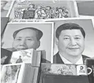  ?? AFP/GETTY IMAGES ?? Posters of President Xi Jinping, right, and Mao Zedong.