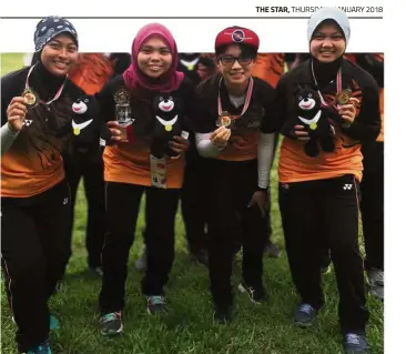  ??  ?? A force to be reckoned with:
Malaysia’s women recurve team (from left) Nur Aliya Ghapar, Nuramalia Haneesha Mazlan, Loke Shin Hui and Nur Afisa Abdul Halil celebratin­g after winning the bronze medal at the Asia Cup in Taiwan in June.