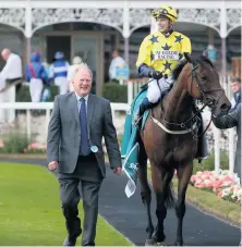  ??  ?? Trainer Jim Goldie after Euchen Glen, ridden by Alistair Rawlinson won the 59th John Smith’s Cup earlier this year