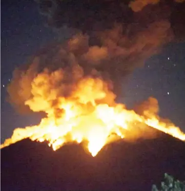  ??  ?? Mount Agung volcano erupts in Bali, Indonesia in this photo obtained from social media. — Reuters photo