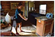  ?? PERLA ARELLANO / AHORA SI ?? Luz Maria Don Juan, a resident of the Country Way Village mobile home park in La Grange, shows what is left of her home. She could only take a few pairs of clothes after she was given five minutes to evacuate, she said. Don Juan said they had just...