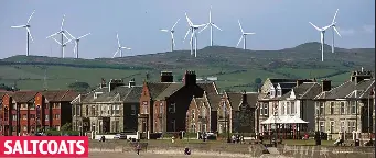  ??  ?? Blot on the landscape: The seaside town in the shadow of turbines