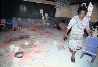  ?? | SIBUSISO NDLOVU African News Agency (ANA) ?? Grade R teacher Nokuthula Sibiya tries to clean up her classroom after it was vandalised over the weekend.