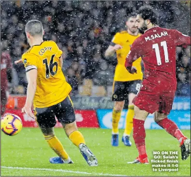  ??  ?? MO ON THE GO: Salah’s flicked finish makes it 1-0 to Liverpool