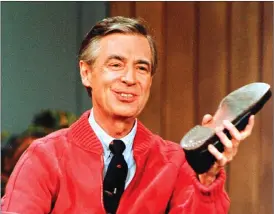  ?? Associated Press photo ?? This 1989 file photo shows Fred Rogers as he rehearses the opening of his PBS show “Mister Rogers' Neighborho­od” during a taping in Pittsburgh.