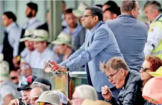  ?? - Pic AFP ?? Minister of Sports Harin Fernando looks a dejected soul in Canberra, Australia, where the Sri Lanka Test cricket team is getting its lessons taught on the field. Minister Fernando had met the members of the Sri Lanka Test cricket team prior to the game, but it looks like nothing works, just as in the field of Sri Lanka football, where the whole network is jammed with confusion, misjudgmen­t and vengeance